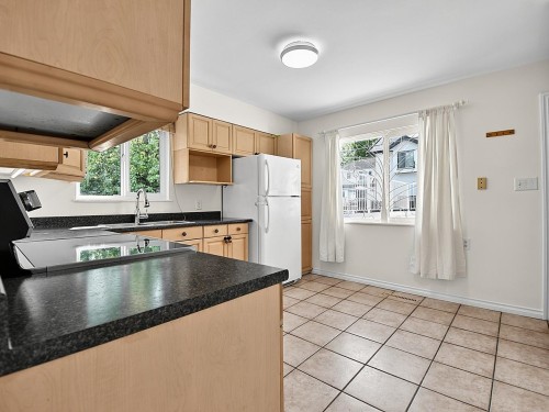2216 41St Avenue E, Vancouver, BC - Indoor Photo Showing Kitchen With Double Sink