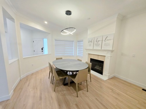 20-5201 Oakmount Crescent, Burnaby, BC - Indoor Photo Showing Dining Room With Fireplace