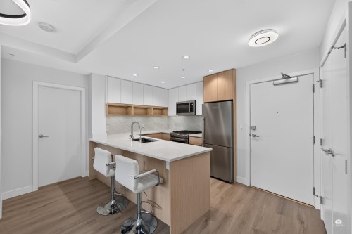 105-8940 University Crescent, Burnaby, BC - Indoor Photo Showing Kitchen With Stainless Steel Kitchen With Double Sink