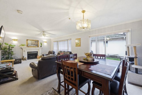 557 44Th Avenue E, Vancouver, BC - Indoor Photo Showing Dining Room With Fireplace