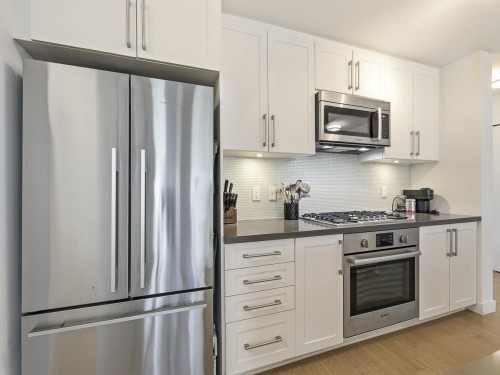 210-10177 River Drive, Richmond, BC - Indoor Photo Showing Kitchen With Stainless Steel Kitchen With Upgraded Kitchen