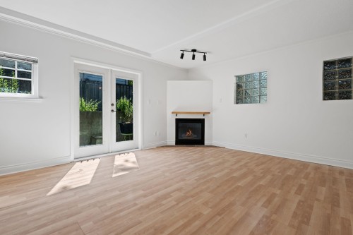 3027 7Th Avenue W, Vancouver, BC - Indoor Photo Showing Living Room With Fireplace