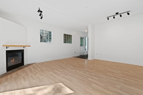 3027 7Th Avenue W, Vancouver, BC - Indoor Photo Showing Living Room With Fireplace
