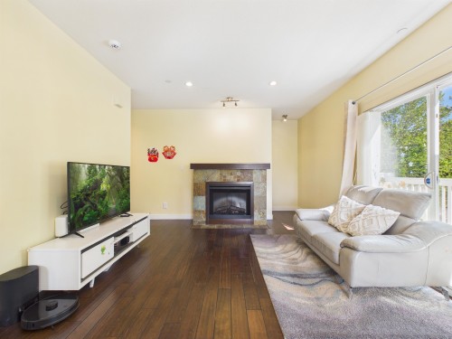 141-7388 Macpherson Avenue, Burnaby, BC - Indoor Photo Showing Living Room With Fireplace