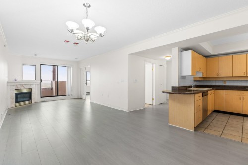 1605-6611 Cooney Road, Richmond, BC - Indoor Photo Showing Kitchen With Fireplace
