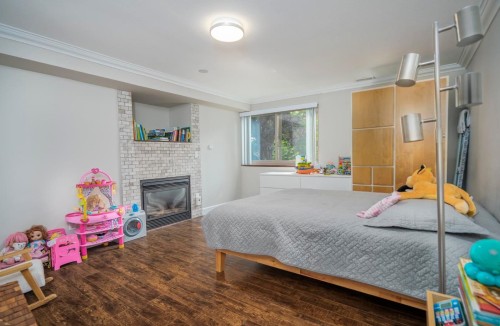 23005 Olund Crescent, Maple Ridge, BC - Indoor Photo Showing Bedroom With Fireplace