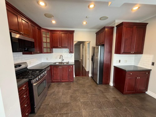 4585 Commercial Street, Vancouver, BC - Indoor Photo Showing Kitchen With Double Sink