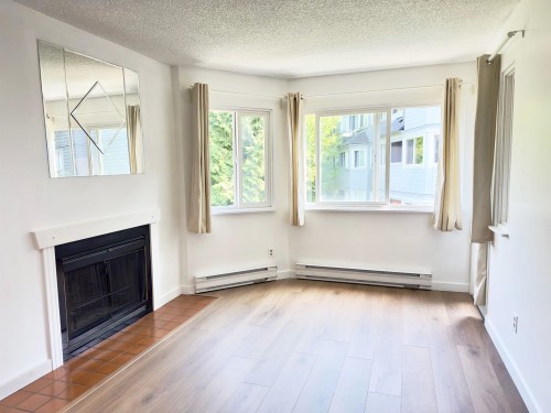 303-9890 Manchester Drive, Burnaby, BC - Indoor Photo Showing Other Room With Fireplace