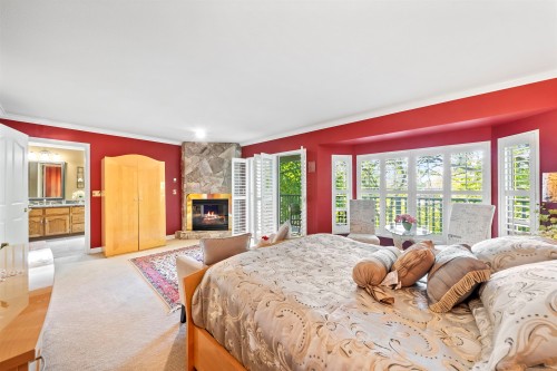 2445 Mowat Place, North Vancouver, BC - Indoor Photo Showing Bedroom With Fireplace