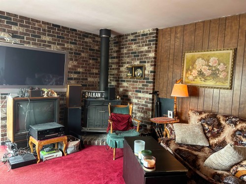 4132 Balkan Street, Vancouver, BC - Indoor Photo Showing Living Room With Fireplace