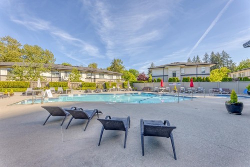 403-3100 Windsor Gate, Coquitlam, BC - Outdoor With In Ground Pool With Backyard