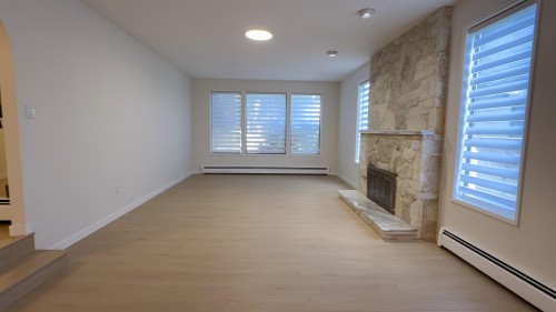 8711 Cullen Crescent, Richmond, BC - Indoor Photo Showing Other Room With Fireplace