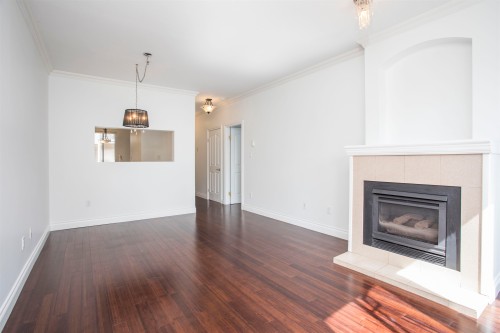 309-2 Renaissance Square, New Westminster, BC - Indoor Photo Showing Living Room With Fireplace