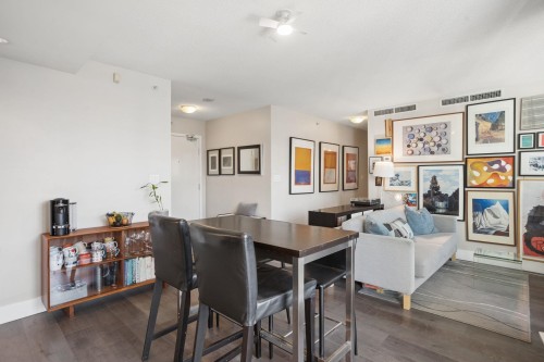 2201-918 Cooperage Way, Vancouver, BC - Indoor Photo Showing Dining Room With Fireplace