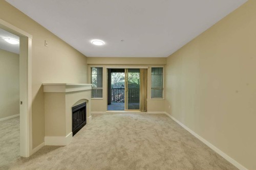 408-2959 Silver Springs Boulevard, Coquitlam, BC - Indoor Photo Showing Other Room With Fireplace