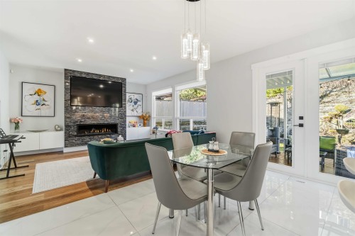 108 Sycamore Drive, Port Moody, BC - Indoor Photo Showing Dining Room With Fireplace