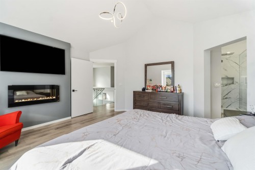 108 Sycamore Drive, Port Moody, BC - Indoor Photo Showing Bedroom With Fireplace