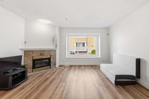 8433 Jellicoe Street, Vancouver, BC - Indoor Photo Showing Living Room With Fireplace
