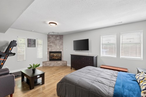 11902 Bruce Place, Maple Ridge, BC - Indoor Photo Showing Bedroom With Fireplace