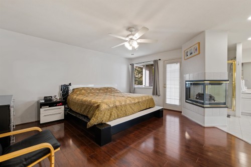 1512 Eagle Mountain Drive, Coquitlam, BC - Indoor Photo Showing Bedroom With Fireplace