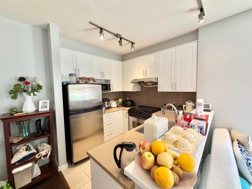 103-4883 Maclure Mews, Vancouver, BC - Indoor Photo Showing Kitchen With Stainless Steel Kitchen