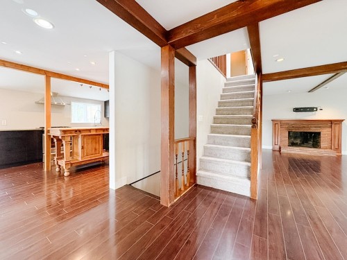 North Vancouver, BC - Indoor Photo Showing Other Room With Fireplace