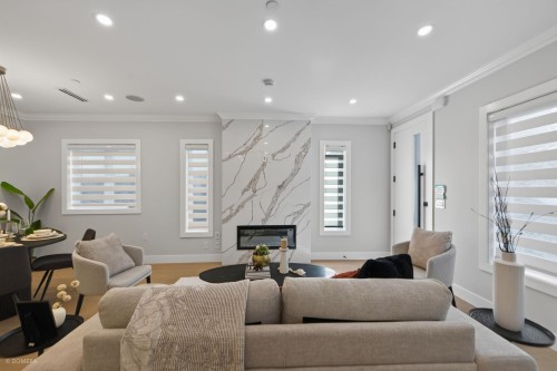 1-2035 51St E, Vancouver, BC - Indoor Photo Showing Living Room With Fireplace