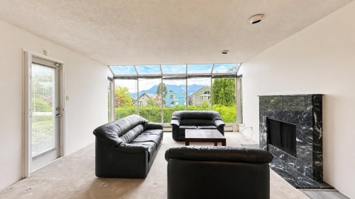 4438 4Th Avenue W, Vancouver, BC - Indoor Photo Showing Living Room With Fireplace