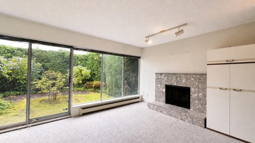 4438 4Th Avenue W, Vancouver, BC - Indoor Photo Showing Living Room With Fireplace