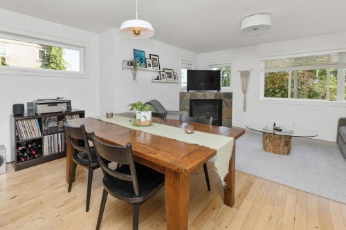 3-728 Gibsons Way, Gibsons, BC - Indoor Photo Showing Dining Room With Fireplace
