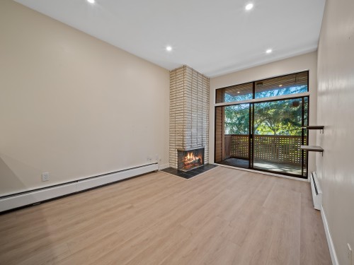 402-2211 2Nd Avenue W, Vancouver, BC - Indoor Photo Showing Other Room With Fireplace