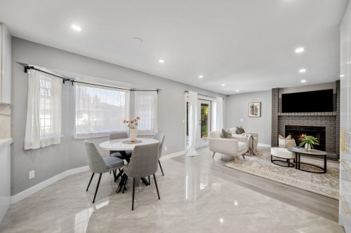 2480 Gale Avenue, Coquitlam, BC - Indoor Photo Showing Dining Room With Fireplace
