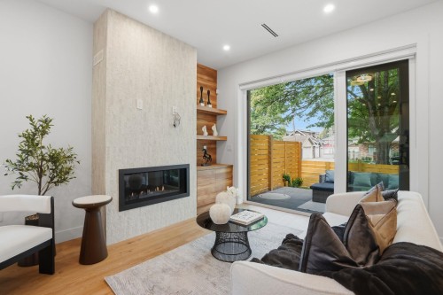 1-2438 20Th Avenue E, Vancouver, BC - Indoor Photo Showing Living Room With Fireplace