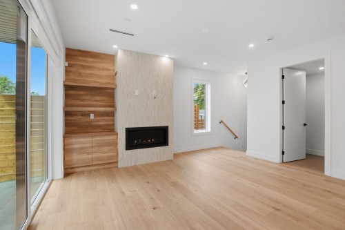 2-2438 20Th Avenue E, Vancouver, BC - Indoor Photo Showing Other Room With Fireplace