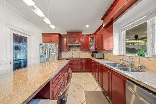 3557 47Th Avenue E, Vancouver, BC - Indoor Photo Showing Kitchen With Double Sink