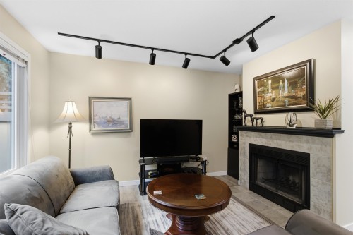14-2736 Atlin Place, Coquitlam, BC - Indoor Photo Showing Living Room With Fireplace