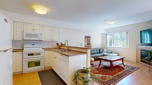 34-735 Park Road, Gibsons, BC - Indoor Photo Showing Kitchen With Fireplace With Double Sink