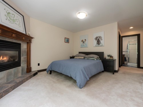 5836 Marine Way, Sechelt, BC - Indoor Photo Showing Bedroom With Fireplace