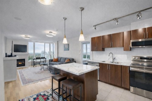 3003-1178 Heffley Crescent, Coquitlam, BC - Indoor Photo Showing Kitchen With Fireplace With Double Sink