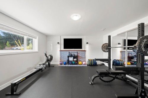 5301 10A Avenue, Delta, BC - Indoor Photo Showing Gym Room With Fireplace