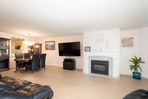 112-4955 River Road, Delta, BC - Indoor Photo Showing Living Room With Fireplace