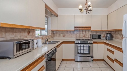 5433 Ash Street, Vancouver, BC - Indoor Photo Showing Kitchen With Double Sink
