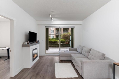 112-7478 Byrnepark Walk, Burnaby, BC - Indoor Photo Showing Living Room With Fireplace