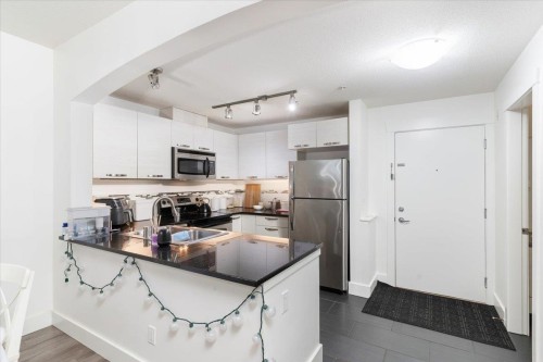 112-7478 Byrnepark Walk, Burnaby, BC - Indoor Photo Showing Kitchen With Double Sink