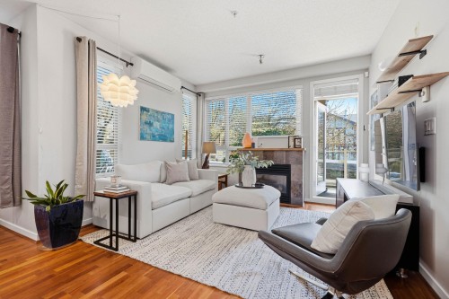 223-530 Raven Woods Drive, North Vancouver, BC - Indoor Photo Showing Living Room With Fireplace