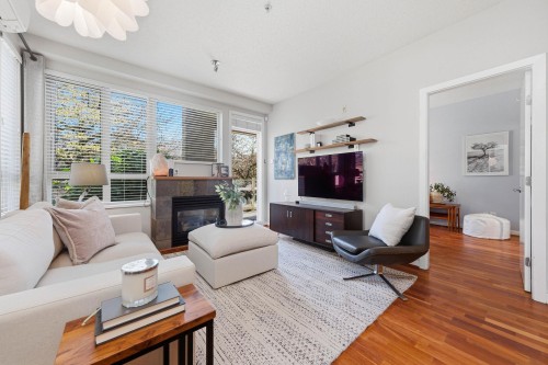 223-530 Raven Woods Drive, North Vancouver, BC - Indoor Photo Showing Living Room With Fireplace