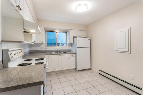 8468 Osler Street, Vancouver, BC - Indoor Photo Showing Kitchen With Double Sink