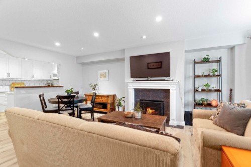 A102-4811 53 Street, Delta, BC - Indoor Photo Showing Living Room With Fireplace