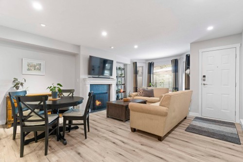 A102-4811 53 Street, Delta, BC - Indoor With Fireplace