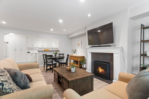 A102-4811 53 Street, Delta, BC - Indoor Photo Showing Living Room With Fireplace
